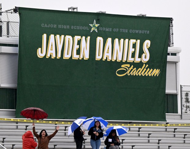 A banner is unveiled as the Cajon High football stadium is named after recent Heisman Trophy winner and 2019 Cajon High graduate Jayden Daniels during a homecoming ceremony at the San Bernardino school for the LSU quarterback Saturday, Jan. 20, 2024. (Photo by Will Lester, Inland Valley Daily Bulletin/SCNG)