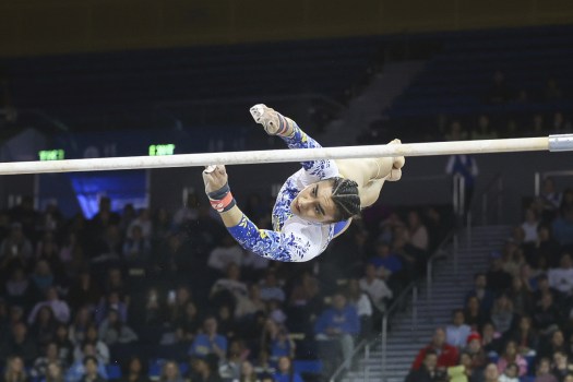 UCLA’s Frida Esparza performs a release during her bar routine during an NCAA gymnastics meet against Utah, Monday, Feb. 19, 2024, in Los Angeles. (AP Photos/Tracy Gitnick)
