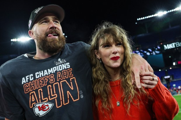 Travis Kelce of the Kansas City Chiefs (L) celebrates with Taylor Swift after defeating the Baltimore Ravens in the AFC Championship Game at M&T Bank Stadium on January 28, 2024 in Baltimore, Maryland. (Photo by Patrick Smith/Getty Images)